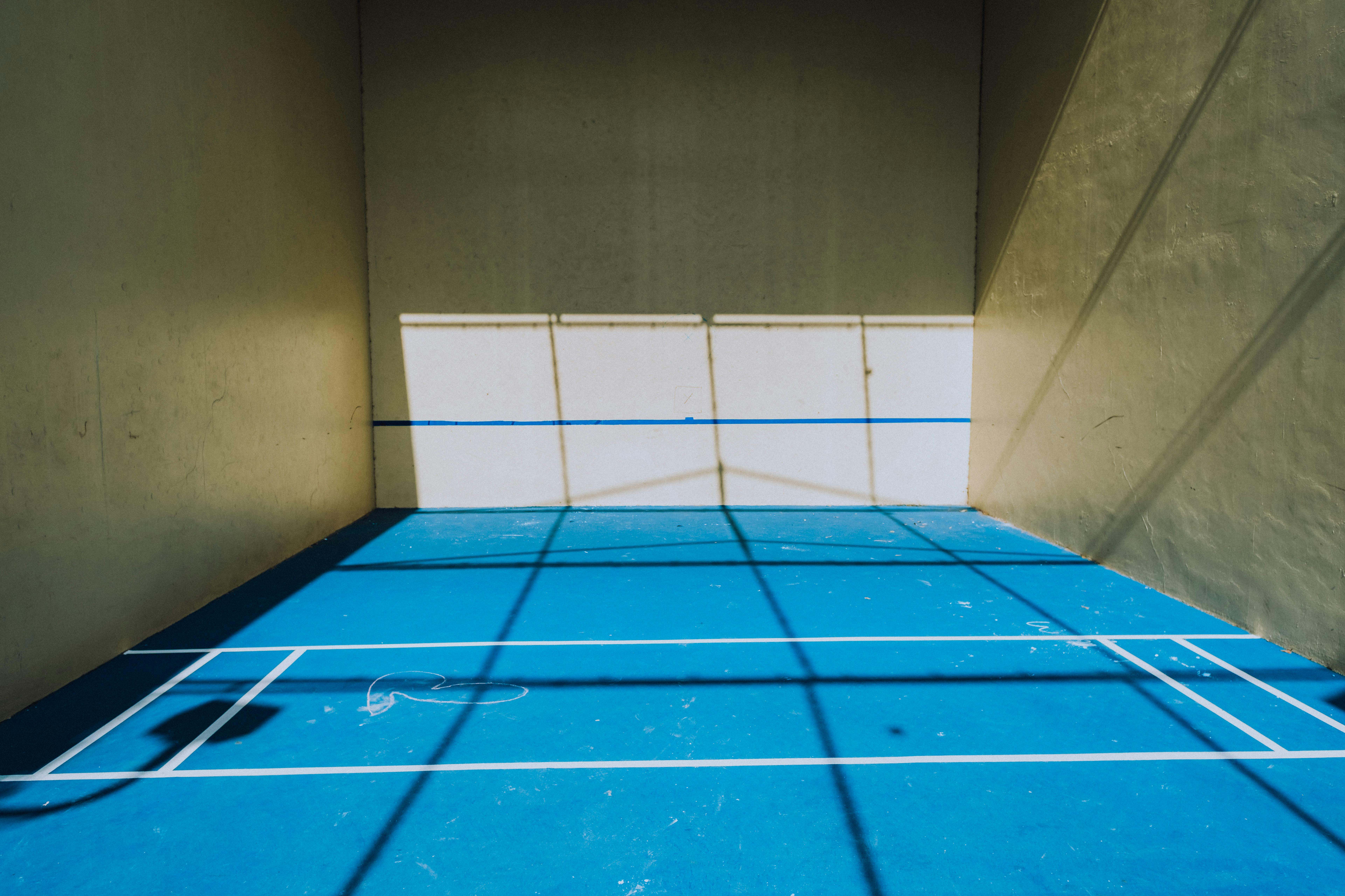 Players enjoying a pickleball game on an indoor court.